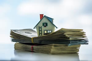 House sitting on top of money - 2022 - Collecting Assessments